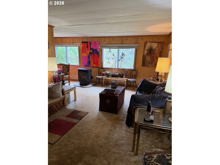 64294 Penny Road Coos Bay, OR 97420 - Photo 6 of 26 a living room with furniture and a window