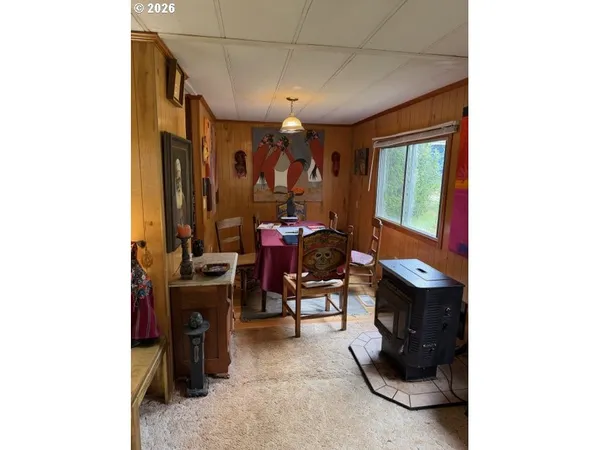 a kitchen with a refrigerator and a stove