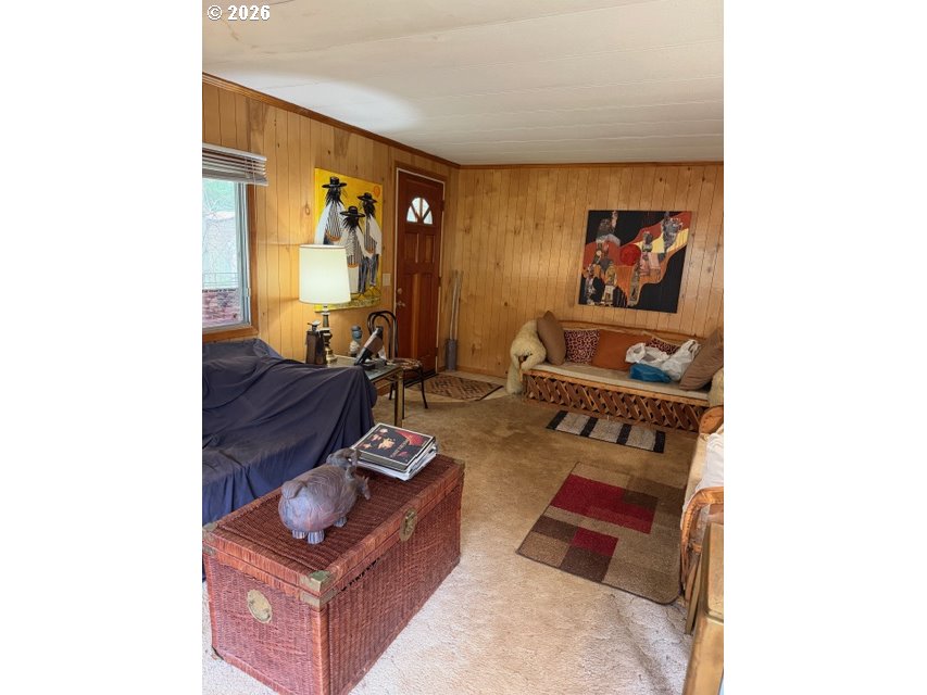 64294 Penny Road Coos Bay, OR 97420 - Photo 9 of 26 a living room with furniture and a window