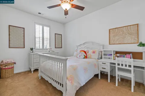 a bedroom with a bed and a table