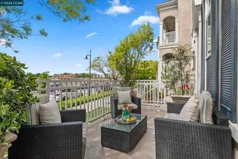 a view of a roof deck with couches