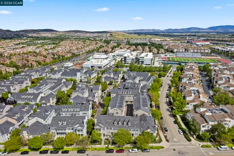 an aerial view of residential building and trees