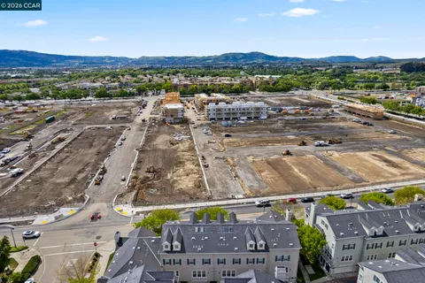 a view of a city with mountains in the background