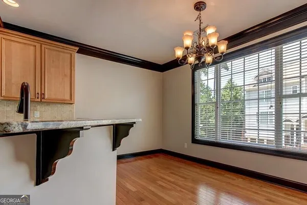 a view of a kitchen with a sink and a window