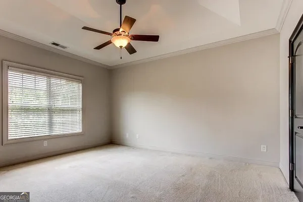 a view of an empty room with a window