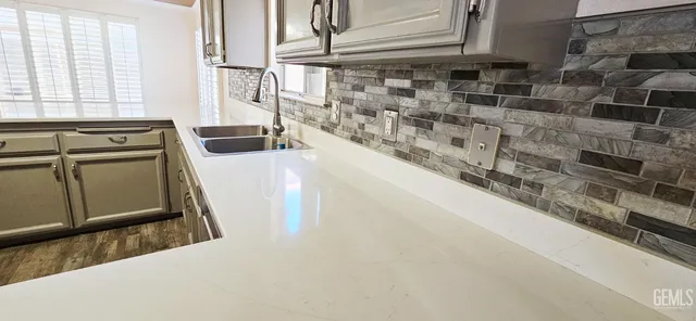 a kitchen with a stove and a refrigerator