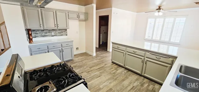 a bathroom with a granite countertop sink a vanity and a mirror