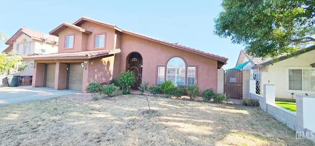 a kitchen with stainless steel appliances a stove a sink a microwave and a refrigerator
