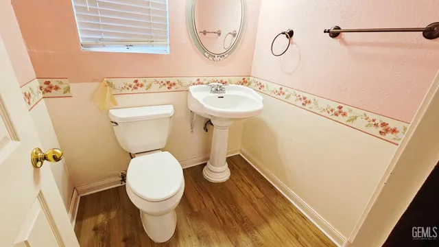 a bathroom with a mirror a bathtub and a sink