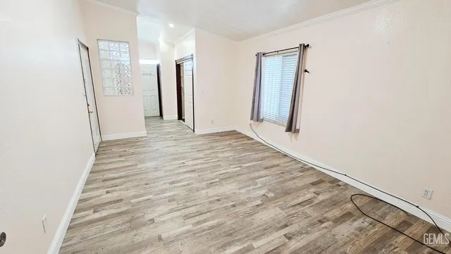 a bathroom with a double vanity sink a mirror and a bathtub