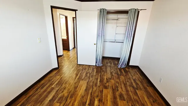 a view of a house with backyard porch and sitting area