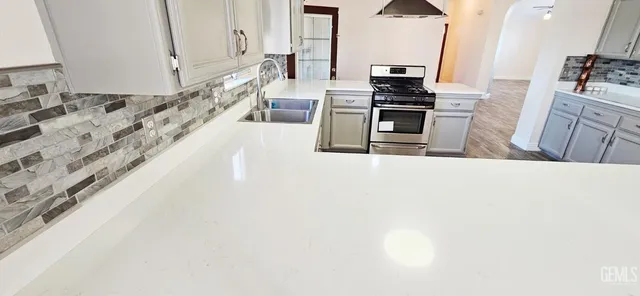 a bathroom with a sink and a large mirror