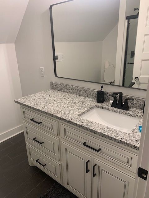 1141 Rogues Fork Road Bethpage, TN 37022 - Photo 47 of 55 a bathroom with a granite countertop sink and a mirror