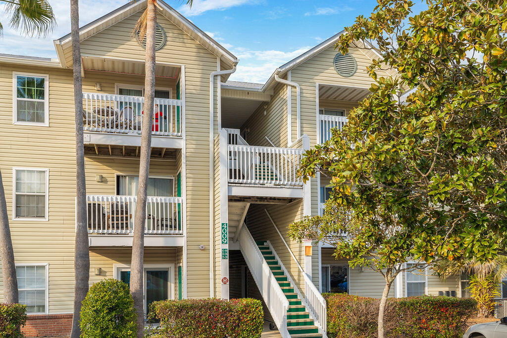 4009 Dancing Cloud Court, Unit 28 Destin, FL 32541 - Photo 24 of 25 a front view of a house with a yard