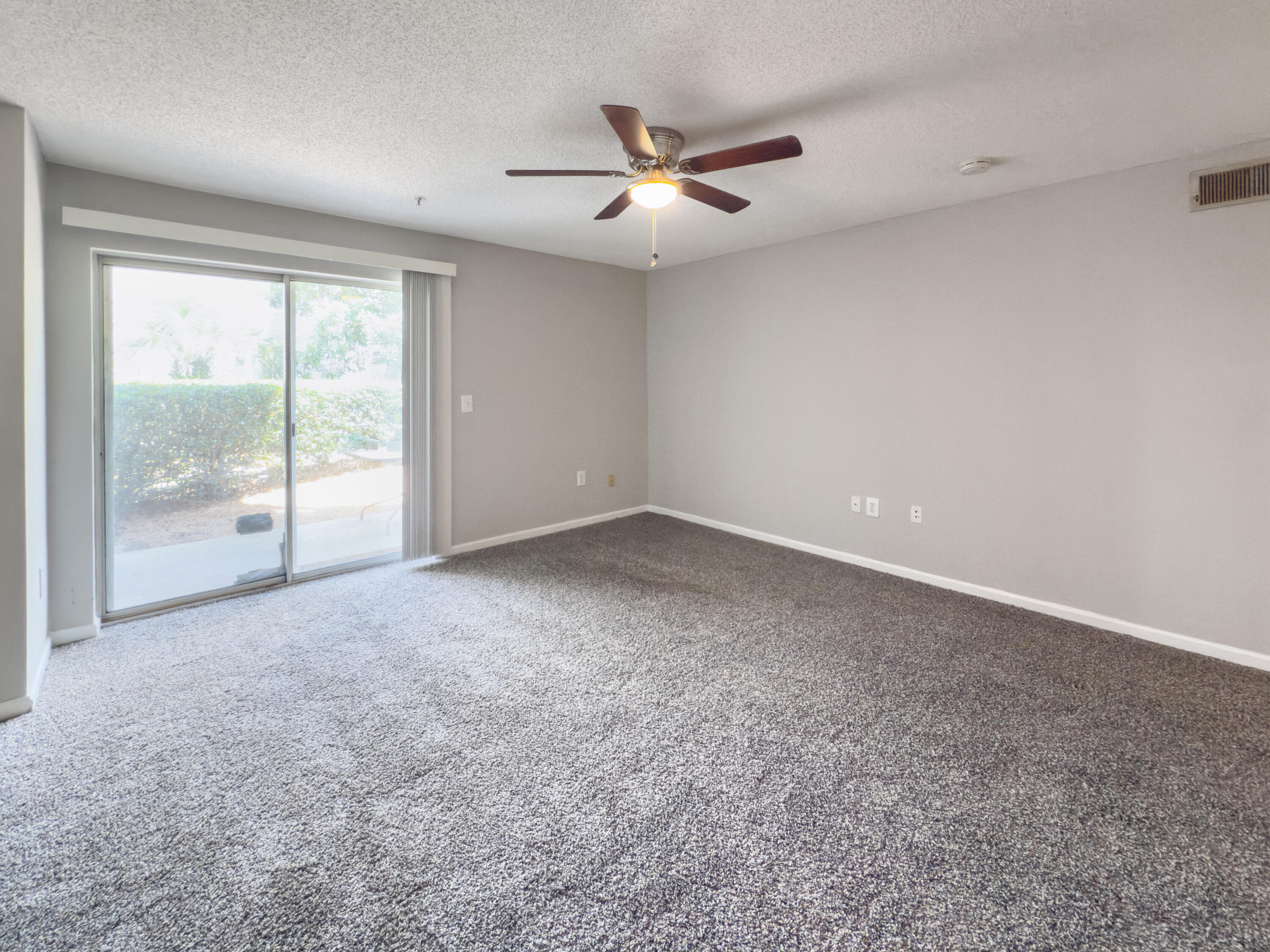 4009 Dancing Cloud Court, Unit 28 Destin, FL 32541 - Photo 5 of 25 a view of a livingroom with a ceiling fan and window