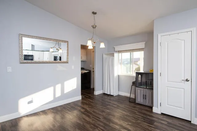 a bedroom with a bed and a television