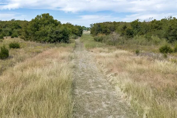 a view of a lake with green space