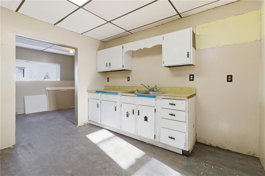 399 Cherry Street Cherry Tree, PA 15724 - Photo 6 of 24 a kitchen with cabinets appliances a sink and a window
