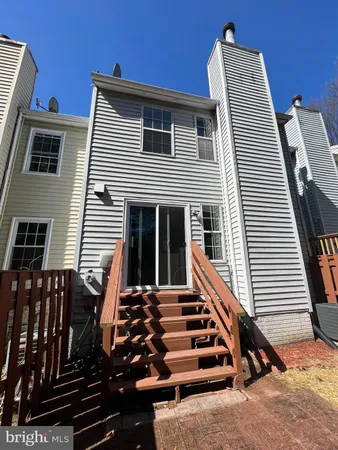 a front view of a house with stairs
