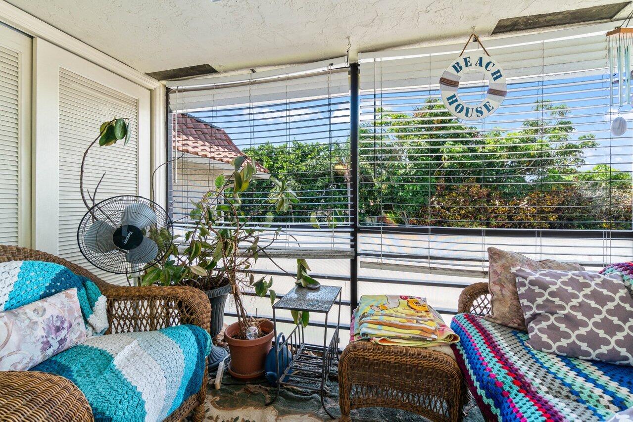 1124 Northwest 13th Street, Unit 204A Boca Raton, FL 33486 - Photo 20 of 30 a bedroom with furniture and a window