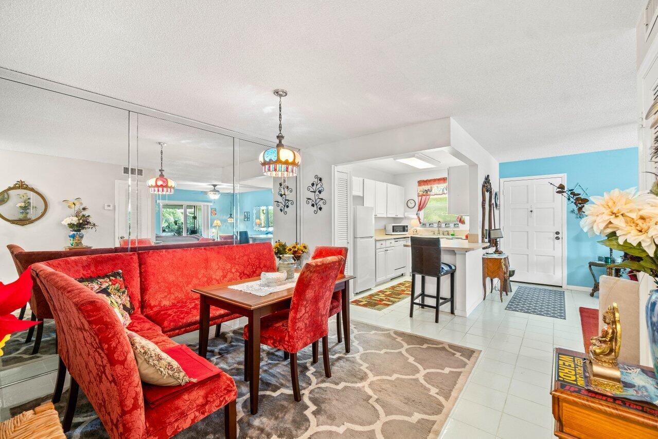 1124 Northwest 13th Street, Unit 204A Boca Raton, FL 33486 - Photo 2 of 30 a view of a dining room with furniture