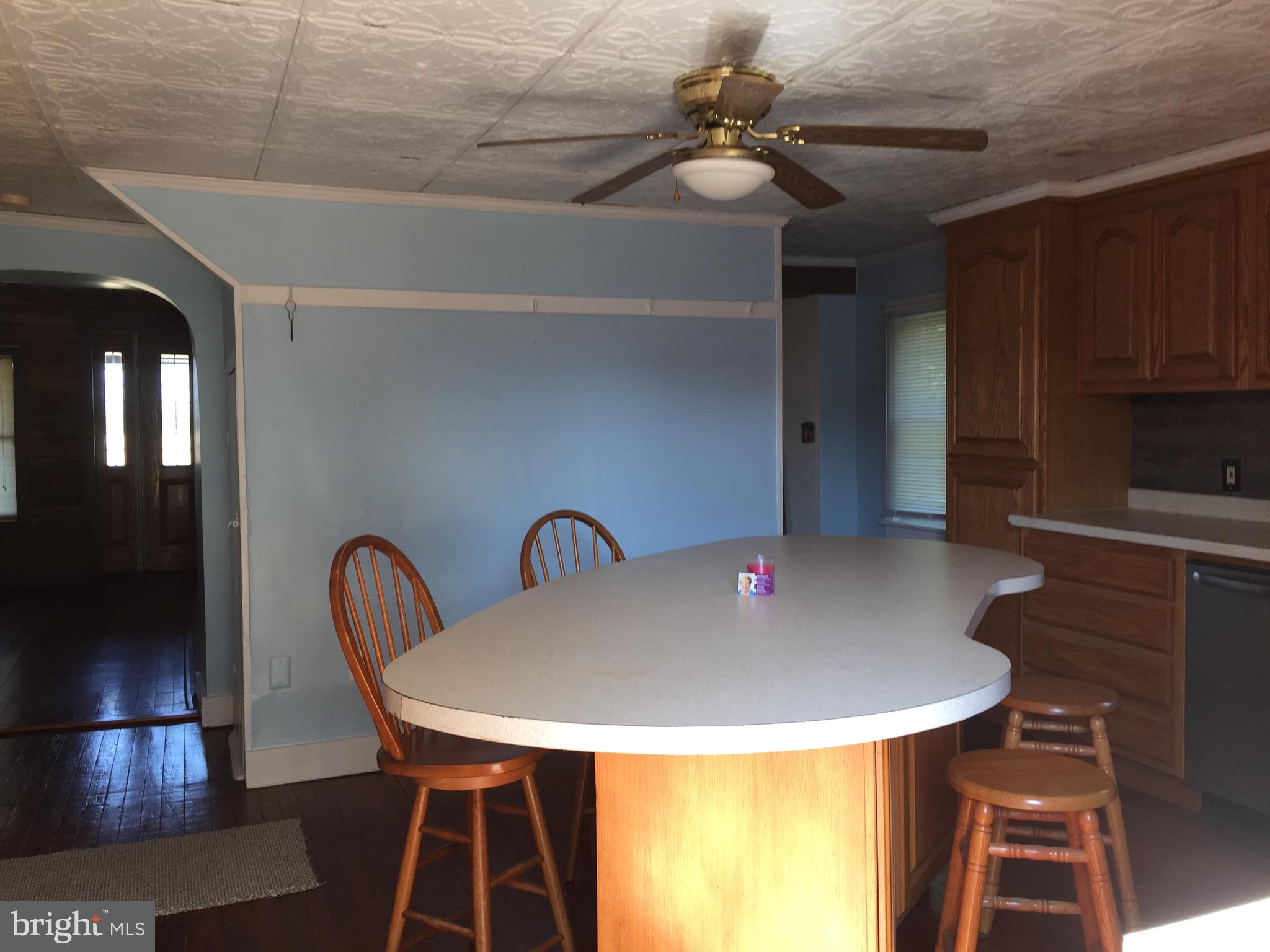 5843 Conover Road Taneytown, MD 21787 - Photo 7 of 11 Kitchen Island -ceiling fan & stools