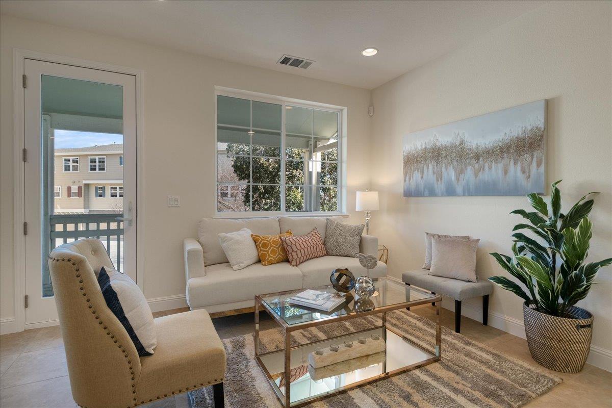 635 True Wind Way, Unit 515 Redwood City, CA 94063 - Photo 11 of 46 a living room with furniture potted plant and a window