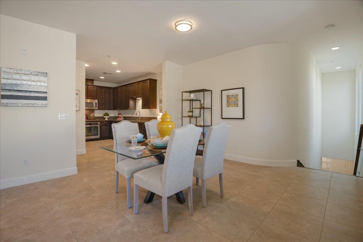 635 True Wind Way, Unit 515 Redwood City, CA 94063 - Photo 13 of 46 a living room with furniture and kitchen view