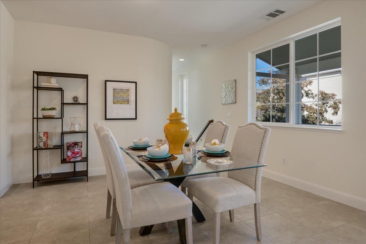 635 True Wind Way, Unit 515 Redwood City, CA 94063 - Photo 14 of 46 a view of a dining room with furniture and chandelier