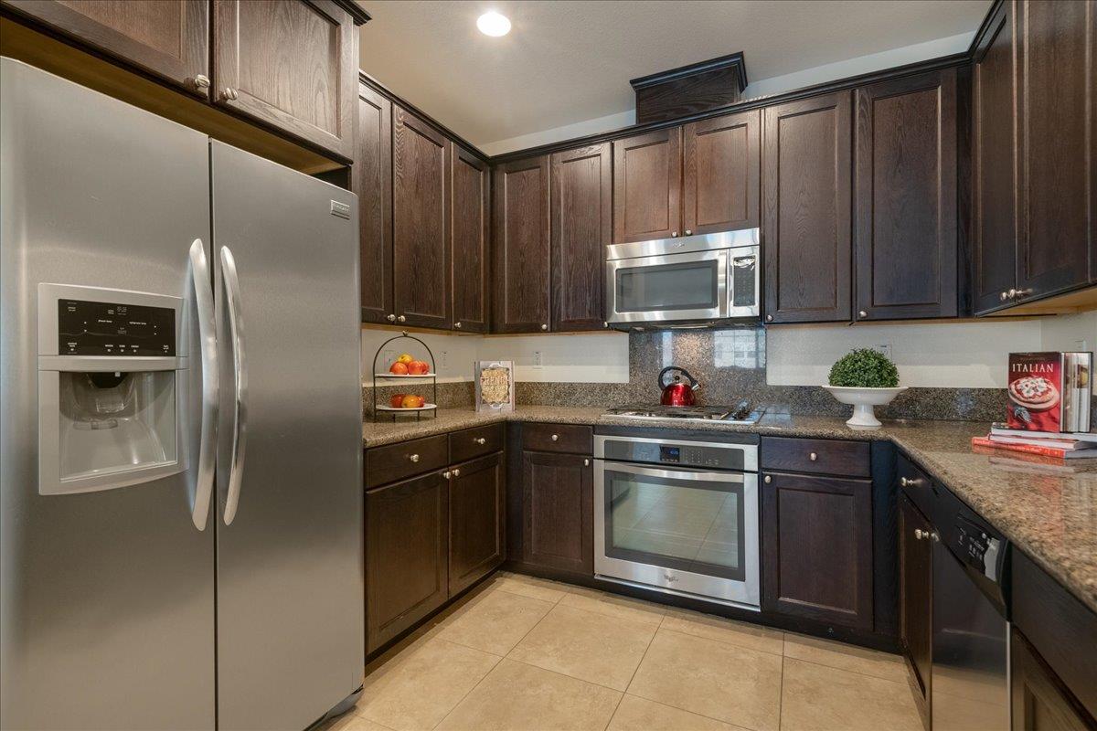 635 True Wind Way, Unit 515 Redwood City, CA 94063 - Photo 18 of 46 a kitchen with a sink stove and refrigerator