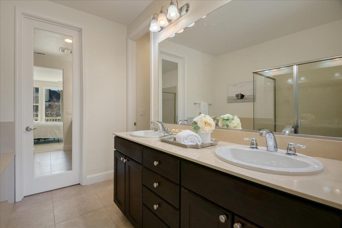 635 True Wind Way, Unit 515 Redwood City, CA 94063 - Photo 33 of 46 a bathroom with a double vanity sink and a mirror
