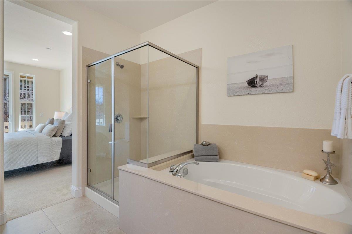 635 True Wind Way, Unit 515 Redwood City, CA 94063 - Photo 35 of 46 a bathroom with a tub sink and shower