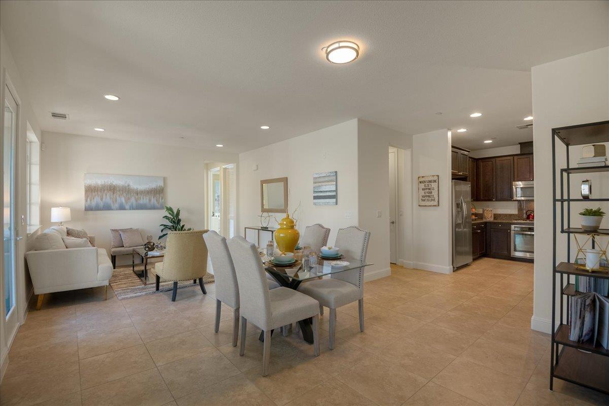 635 True Wind Way, Unit 515 Redwood City, CA 94063 - Photo 7 of 46 a living room with furniture and a flat screen tv