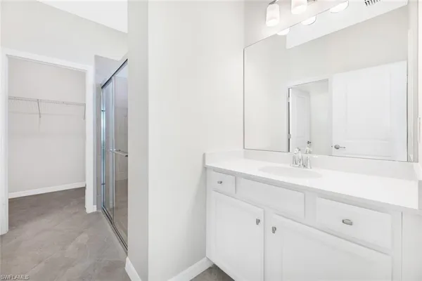 a bathroom with a sink and mirror