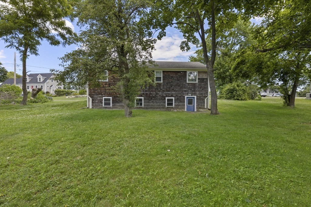 13 Hillcrest Road Scituate, MA 02066 - Photo 23 of 30 a front view of a house with garden and trees