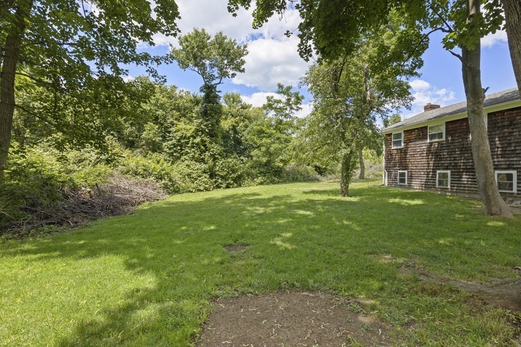 13 Hillcrest Road Scituate, MA 02066 - Photo 25 of 30 a view of a yard with plants and large trees