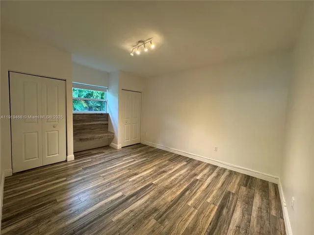 a view of wooden floor and staircase in a room
