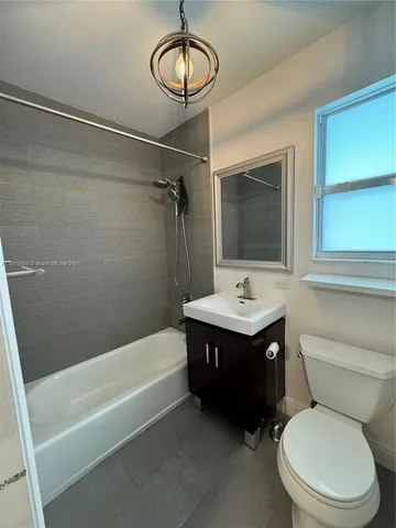 a bathroom with a sink a toilet and a bathtub