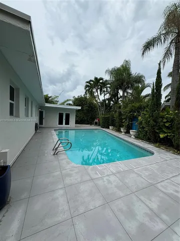 a view of backyard with green space