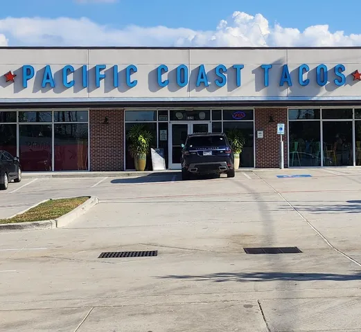 a view of a car park in front of house