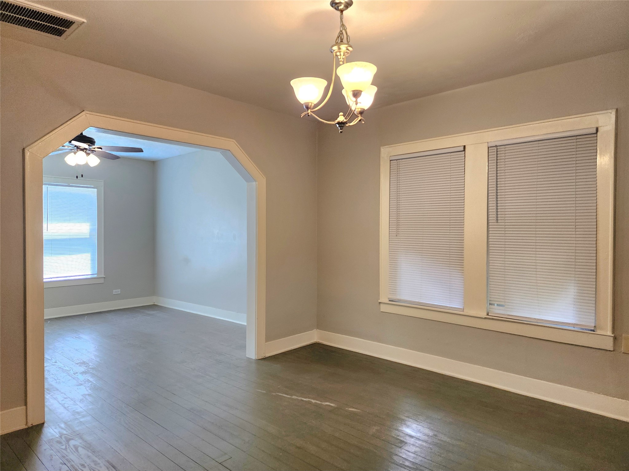 6306 Stillman Street Houston, TX 77007 - Photo 4 of 19 a view of an empty room with wooden floor and a window
