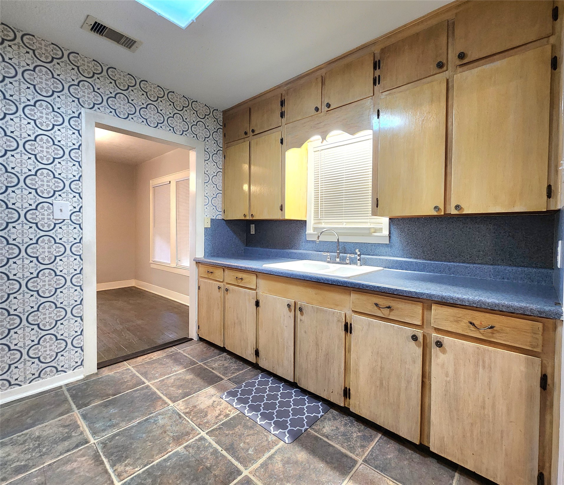 6306 Stillman Street Houston, TX 77007 - Photo 7 of 19 a bathroom with a granite countertop sink and a mirror