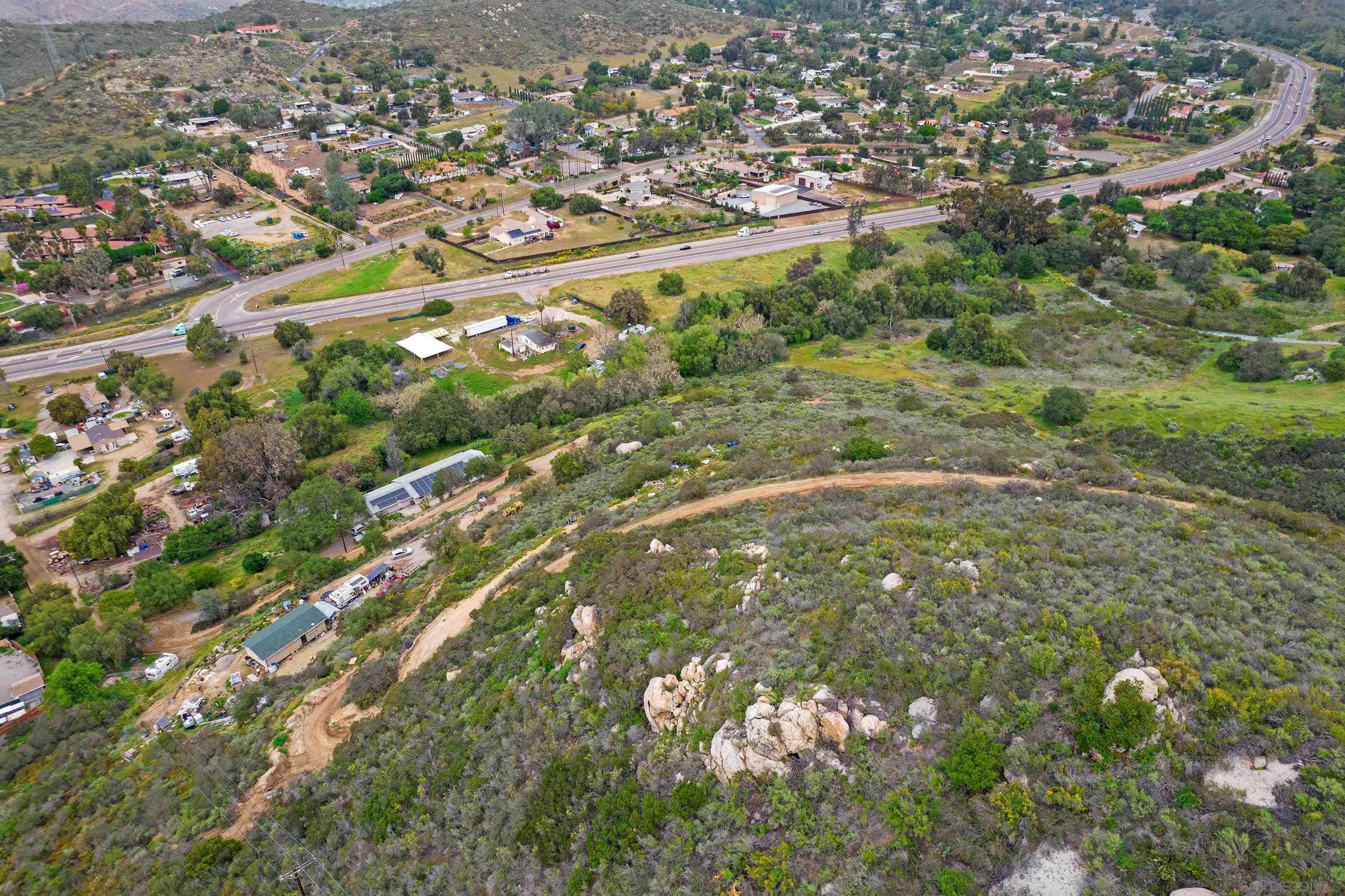 0 Highway 94 Spring Valley, CA 91978 - Photo 16 of 21 an aerial view of residential houses with outdoor space and trees