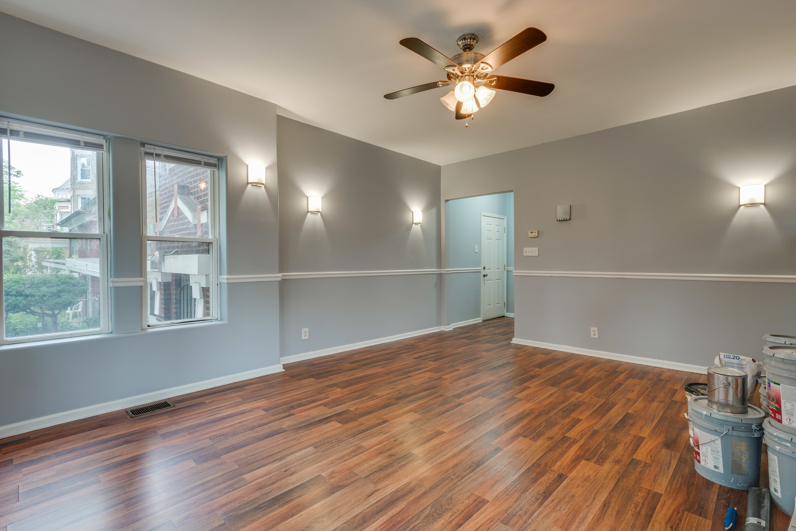 1326 East 72nd Street, Unit 1 Chicago, IL 60619 - Photo 3 of 10 a view of an empty room with a window and wooden floor