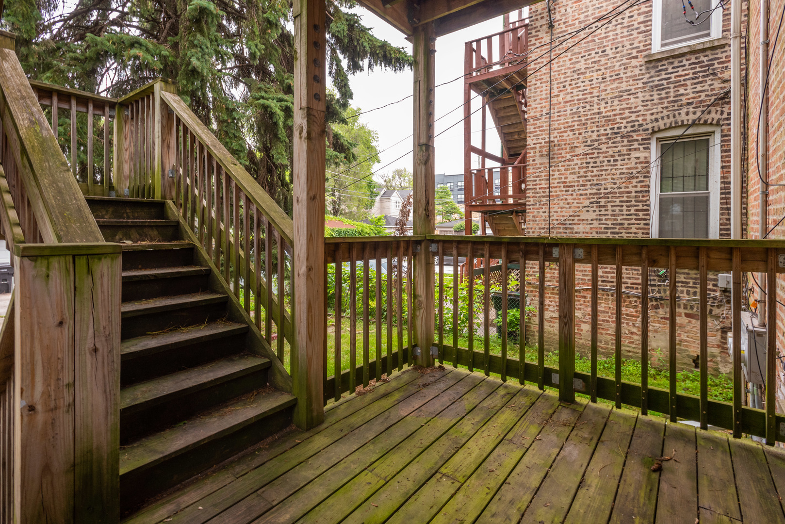 1326 East 72nd Street, Unit 1 Chicago, IL 60619 - Photo 9 of 10 a view of a balcony with wooden floor