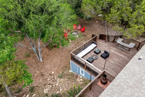 a view of a backyard with sitting area