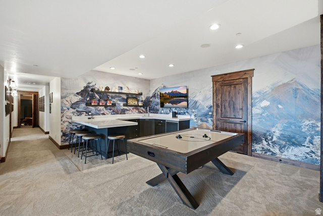 7885 North Rabbitbrush Court, Unit 13 Park City, UT 84098 - Photo 41 of 88 Recreation room featuring a built-in wet bar with a light-toned countertop and dark cabinetry