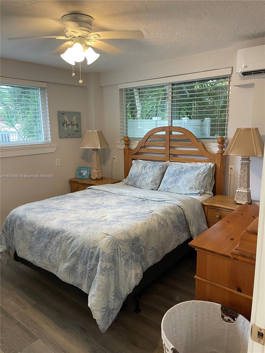 39 Lake Shore Drive Key Largo, FL 33037 - Photo 17 of 27 a bedroom with a bed and window