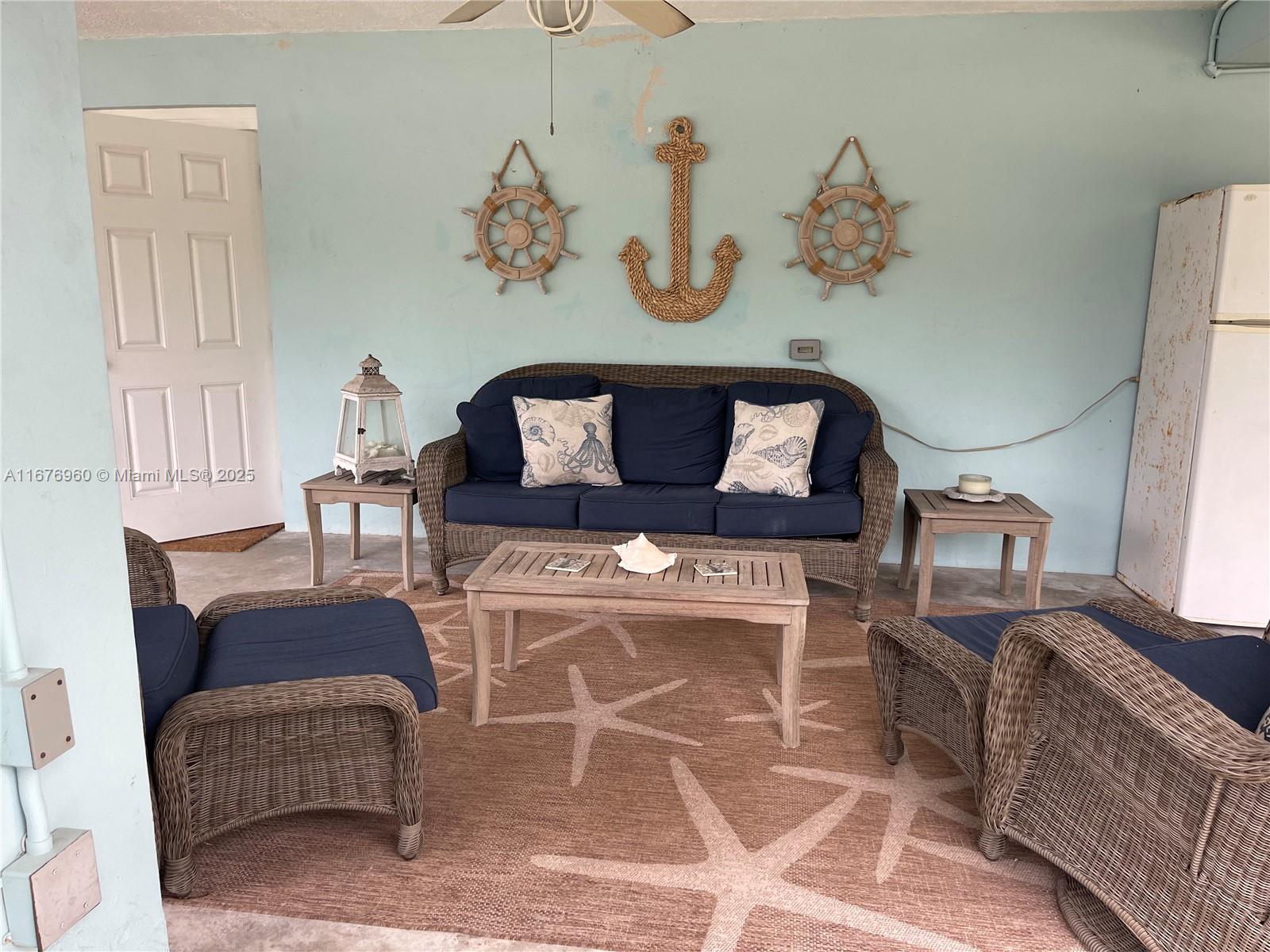 39 Lake Shore Drive Key Largo, FL 33037 - Photo 21 of 27 a living room with furniture flowerpot and window