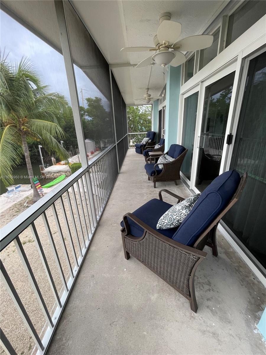39 Lake Shore Drive Key Largo, FL 33037 - Photo 22 of 27 a living room with furniture